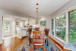 a kitchen and dining room with a table and chairs at Spinnaker 780 in Seabrook Island