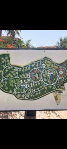 a map of a park on a sign at Palmeraie Village 2 in Marrakesh