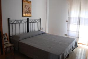 Letto o letti in una camera di Apartment Conchiglie