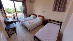 Voodi või voodid majutusasutuse Anetis Hotel toas