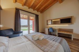 Ένα ή περισσότερα κρεβάτια σε δωμάτιο στο B&B Borgo Marognole