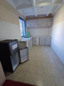 Kuchyň nebo kuchyňský kout v ubytování La Casa Hotel - Nyali