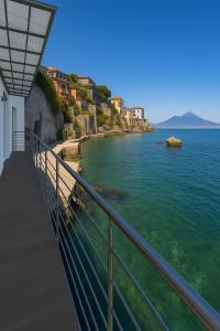 a view of the ocean from a balcony at LA CASA SULL’ ACQUA in Naples
