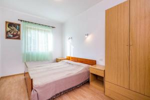 Postel nebo postele na pokoji v ubytování Apartments Nikola