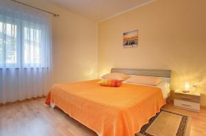Postel nebo postele na pokoji v ubytování Apartments Danilo