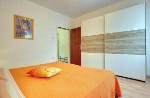 Postel nebo postele na pokoji v ubytování Apartments Danilo