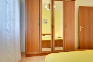 Postel nebo postele na pokoji v ubytování Apartments Danilo