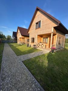 a house with a stone walkway in front of it at Uroki Roztocza w Krasnobrodzie in Krasnobród