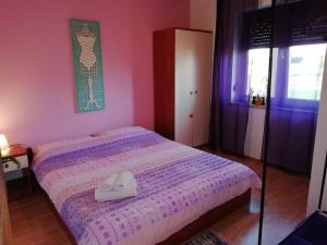 Ένα ή περισσότερα κρεβάτια σε δωμάτιο στο Casa Rossa