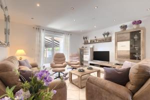 a living room with two couches and a television at Villa Sonja in Medulin