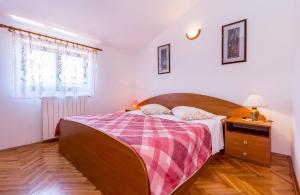 Postel nebo postele na pokoji v ubytování Apartments Winny