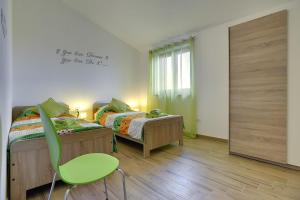 Postel nebo postele na pokoji v ubytování Villa Mareti + 36 fotografií