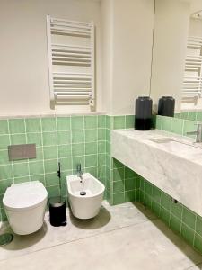 a bathroom with a toilet and a sink at Santa Justa Cozy Room in Lisbon +10 photos