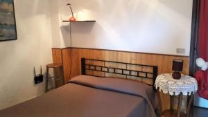 Postel nebo postele na pokoji v ubytování Azienda Agrituristica Villa Arianna
