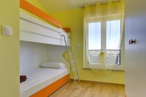 Ein Bett oder Betten in einem Zimmer der Unterkunft Holiday Home Baldini
