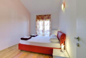 Ein Bett oder Betten in einem Zimmer der Unterkunft Holiday Home Baldini