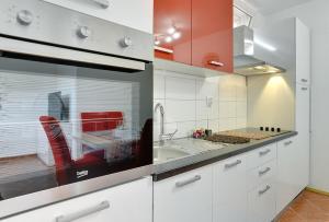 Kuchyň nebo kuchyňský kout v ubytování Apartments Elviana