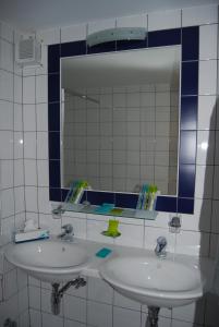 Koupelna v ubytování Hotel du Pigne