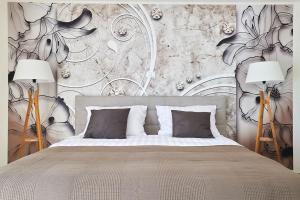 a bedroom with a large bed with two lamps at Villa Dolcea in Umag +44 photos