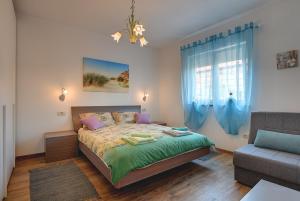 Łóżko lub łóżka w pokoju w obiekcie Holiday Home Veronika