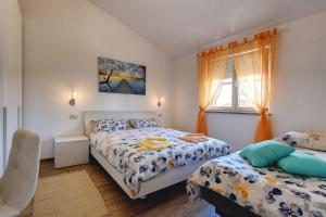 Łóżko lub łóżka w pokoju w obiekcie Holiday Home Veronika