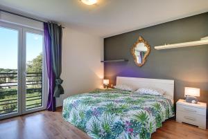 Posteľ alebo postele v izbe v ubytovaní Villa Rubini + 37 fotografií