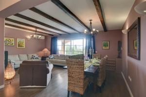 a living room with a table and a couch at Villa Ari in Krnica