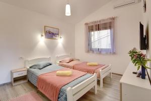 Posteľ alebo postele v izbe v ubytovaní Villetta Ambrosiana + 37 fotografií