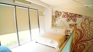 מיטה או מיטות בחדר ב-Lan Yang Resort Four Seasons