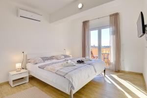Posteľ alebo postele v izbe v ubytovaní Villa Buzdonka
