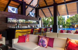 a bar at the resort with couches and a bar at Hard Rock Hotel Goa Calangute in Calangute