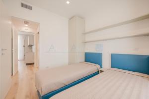 Ένα ή περισσότερα κρεβάτια σε δωμάτιο στο Wave Island Carpo F1
