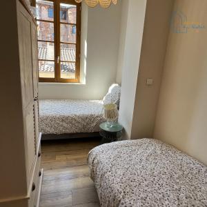 Katil atau katil-katil dalam bilik di Maison cosy au centre-ville