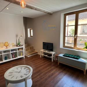 Televisyen dan/atau pusat hiburan di Maison cosy au centre-ville