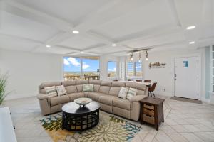 a living room with a couch and a table at Starboard Village Unit 612 in Pensacola Beach