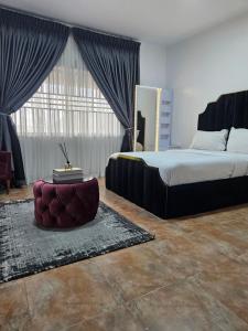 Postel nebo postele na pokoji v ubytování Pearl Homes