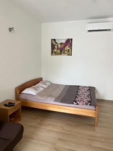 a bedroom with a bed in a room at Apartman Iskra in Bijela