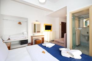 Postel nebo postele na pokoji v ubytování Hotel Klonos - Kyriakos Klonos