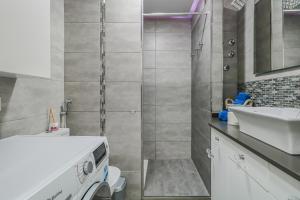 a bathroom with a toilet and a sink at Puerto Cruz Relaxing Shared Pool in Puerto de la Cruz