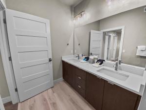a bathroom with a sink and a mirror at 204 Jordanelle Mountain Paradise by SkyRun Park City in Heber City