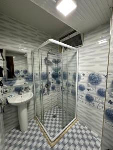 a bathroom with a shower and a sink at Hotel Hirot in Tashkent +41 photos