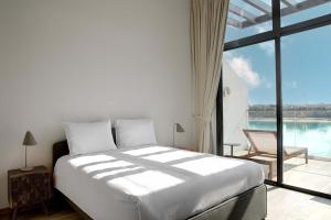Voodi või voodid majutusasutuse Beach Villas by Olala Homes toas