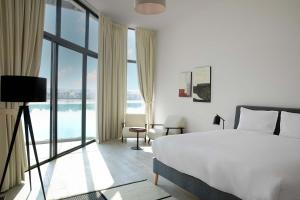 Voodi või voodid majutusasutuse Beach Villas by Olala Homes toas