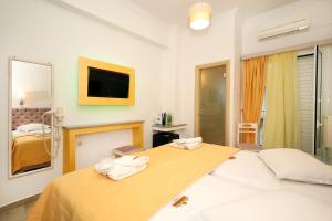 Postel nebo postele na pokoji v ubytování Hotel Klonos - Kyriakos Klonos