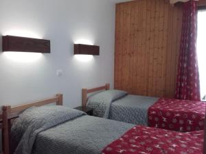 Postel nebo postele na pokoji v ubytování Hôtel Le Mont Jorat