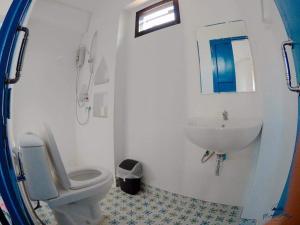 a bathroom with a white toilet and a sink at Luna Rose ลาลูน่าวินเทจโฮมเขาใหญ่ in Pong Talong +20 photos