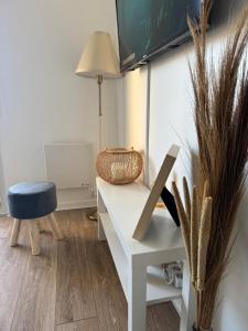 a room with a desk and a chair and a lamp at Small Bubble in Toulouse, France T2-Parking-1KmMetro-WiFi-Cosy in Ramonville-Saint-Agne