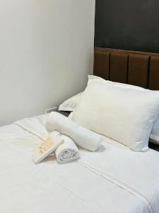Postel nebo postele na pokoji v ubytování The Hive Staycation