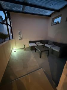 a living room with a couch and a table at Apartment Bad Nauheim central in Bad Nauheim