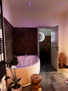 a bathroom with a large tub in a room at Zephir Green in Brindisi